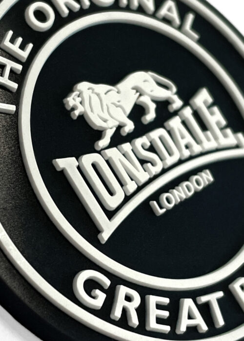 schlüsselanhänger de gummi negro/blanco